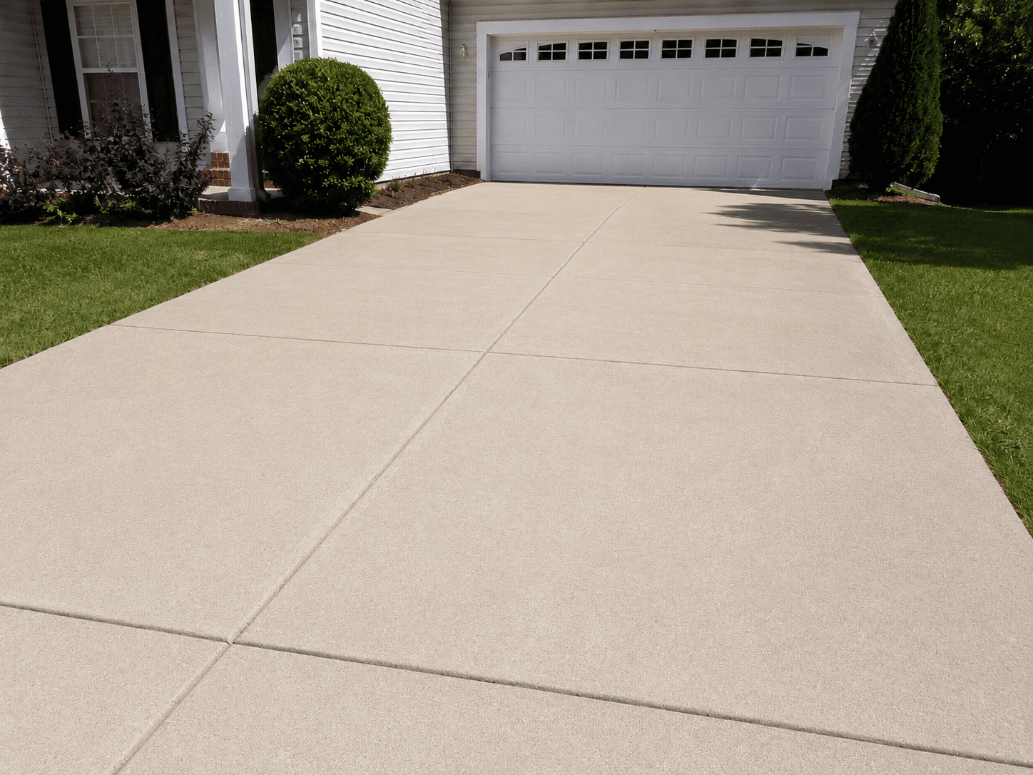 Driveway after pressure washing (temporary AI concept image)